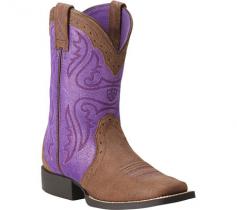 Proudly watch her collect her blue ribbon in the Ariat Trailblazer boot. Assembled using a double-stitched welt, this riding-approved girls' cowboy boot is offered in rich, full grain leather and metallic-finish suede, accented with perforations, piping, and an ornate stitch pattern for traditional Western flair. Not only does it feature Ariat's 4LR (Four-Layer Rebound) comfort features, but includes the removable Ariat Booster Bed to create extra room as her feet grow, increasing the usability of the boot. The Ariat Trailblazer Western boot sits atop a stacked-look heel and is finished with a durable synthetic outsole.
