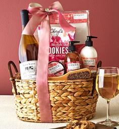 Send the gift of ultimate pampering and quiet relaxation! Our lovely hyacinth spa basket includes Source Vérité Imperial Cherry Blossom Spa Products, Exfoliating Spa Towel, Pumice Stone with wood handle, Mira Luna Tough Day Chardonnay or Geerlings & Wade Merlot Wine and decadent Cheryl's Chocolate Chip Cookies. Mira Luna&reg; Tough Day Chardonnay WineThis renowned wine scored 91 Points and took Silver at the World Wine Championship. Unobstructed by oak, Sonoma Carneros Chardonnay fruit provides wonderful aromas of peach, pear and melon, while a touch of Muscat provides accessibility. Geerlings & Wade&reg; 2011 Merlot WineThis California wine pays tribute to the Chateau relationships and history behind the brand. Harvests from extraordinary vineyards located in Napa, Sonoma and the Central Coast converge each year into a wine blend of great quality and value. Fruit from each component block is harvested, sorted, then gravity fed into either oak or stainless steel fermentation tanks. Oval Hyacinth Basket with Faux Leather HandlesWoven Iridescent Pink RibbonMira Luna Tough Day Chardonnay Wine or Geerlings & Wade Merlot WineCheryl's Chocolate Chip CookiesExfoliating Spa TowelPumice Stone with wood handle Source Vérité Imperial Cherry Blossom Spa Products: Body LotionExfoliating Shower GelHand and Foot LotionMeasures 13.75"L x 8.875"W x 14.25"H