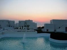 Located on the east coast of the island of Paros, this charming venue is an ideal place for anyone looking for a sun-soaked holiday. Build in the traditional Cycladic style and sitting on the top of a small hill it can treat its guests to mesmerising views over the Aegean Sea and the breath-taking Greek sunsets. They will also be just a 10-minute walk from the crystalline waters and the sandy paradise of the Agia Eirini beach. Those who want a little more privacy can take advantage of the 500 m&sup2; onsite swimming pool, where they can enjoy an amazingly refreshing cocktail and small snacks from the poolside snack bar. For dining the restaurant located on the premises offers amazing local and international cuisine and is perfect for those that don't feel like taking the 10-minute drive to the city centre Paroikia and its restaurants.