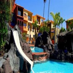 The attractive Park Club Europe Hotel is conveniently situated in the popular holiday resort of Playa de Las Américas, in the southwest of Tenerife. Some of the island's most beautiful beaches can be reached within a few minutes' walk. The resort centre with its multitude of restaurants, bars, shops and entertainment venues is within a short stroll. The centre of Los Cristianos and the Las Américas Golf Course are within walking distance. The complex is surrounded by a huge topical garden with exuberant vegetation inhibited by geese, rabbits and parrots as well as two large oasis-style pools. The rooms are decorated in a Mediterranean style with warm, friendly colours and enjoy pool, garden or exterior views. Guests will appreciate various on-site restaurants and bars as well as the sports facilities. A nice place for couples and families to spend some lovely holidays under the famous Canary sun.