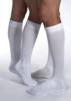 Jobst ActiveWear 15-20, 20-30, 30-40 mmHg Knee High Compression Socks Features: The ideal combination of therapeutic efficacy and Dri-release yarn for superior moisture control. Fits an active lifestyle with a seamless toe and 360degrees cushioned foot for increased wearing comfort. All-day comfort knee band that keeps socks up without binding or pinching. Reinforced heel resists abrasion and provides greater durability. Circumference measurements of the Ankle and Calf will determine correct size, see chart below for finding the best fit. Available Colors: Black, White. Description: The Jobst ActiveWear Knee High Compression Socks are effective leg therapy in an energizing athletic sock, ideal for various activities, from walking to playing sports. They are the ideal combination of therapeutic efficacy and Dri-release yarn for superior moisture control.