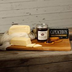 Enjoy Eichten's cheese and jam assortment as a snack, breakfast or hors d'oeuvres paired with your favorite wine. State of Origin: Minnesota Set includes: 1/2 pound Dutch Gouda, 1/2 pound Havarti, 8-ounce jarm Minnesota triple berry jam, one (1) box specialty crackers Dutch Gouda: No coloring, artificial flavors, preservatives or GMO rennet, milk contains no growth hormones, antibiotics or rBGH Havarti: Deliciously mild, very creamy, natural, semi-soft cheese Minnesota triple berry jam: Juicy ripe strawberries, raspberries and blueberries, cooked with just enough pure sugar Brand: Eichtens Cheese and Bison Container: Box Weight: 4 pounds This product is part of our 'Farmers Market'. Due to the perishable nature of this artisanal product, returns cannot be accepted. This Purveyor's Story: Joe and Mary Eichten never dreamed that they would be international cheese makers. In 1975, Joe was running the family dairy farm while Mary was raising their 10 children. That year, they decided to turn their dairy into a farmstead cheese plant as part of the University of Minnesota's pilot program. Producing gourmet European-style cheeses, Eichten's Hidden Acres began raising bison on the farm to offer an all-natural, healthy meat along with their artisan cheese varieties. In 2006, the second generation took over the family business, later joined by the third generation, extending their menu to include a variety of all-natural, rGBH-free cheeses made fresh right on the farm. IMPORTANT: To maintain freshness, this item is only shipped out Monday-Wednesday. Orders may still take up to two business days to process. Please time orders accordingly.