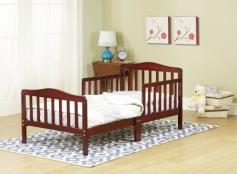 Constructed of all solid wood in a stunning Cherry finish. 2 side safety rails makes an easy transition from crib. 26.5-inch height makes in and out easy. Accommodates standard crib mattress (not included). 53L x 30W x 26.5H inches. If your baby has managed to Houdini his way out of his crib the Orbelle Contemporary Solid Wood Toddler Bed - Cherry is a good choice for his next bed. Crafted of solid wood and built with quality in mind you can rest assured this bed will last. It even includes side safety rails so your little one won't fall out of bed in the night. In addition the perfect height of 26.5 inches ensures easy in and out and more peace of mind for you. All necessary tools are included for easy assembly. Accommodates a standard crib mattress not included. Make the transition smooth and beautiful with the Orbelle Toddler Bed. About Orbelle TradeBegun in Brooklyn NY in 1991 Orbelle has grown into a leading baby and teen furniture business still family owned and operated. Fast shipping and quality furniture with exclusive designs and colors keep Orbelle at the forefront of baby and kids lines of furniture. This solid wood toddler bed from Orbelle Trade is the perfect upgrade for the young child looking to move on from the crib. Featuring sturdy construction and contemporary style, this bed will keep your little one safe and comfortable. The set sits at a height of 26.5 inches, and it even includes safety side rails to prevent any accidental spills or falls. The bed is made to fit a standard crib mattress, making the transition to this new bed an easy one for your child.