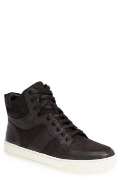 Vince Adam Leather High-Top Sneaker, Black Details Vince high-top smooth and grained calfskin "Adam" sneaker. 1" flat rubber sole; 5" height; 13" circumference. Round toe. Lace-up front. Padded collar. Leather lining and insole. Imported. Sizing note: Vince sneakers run large. We suggest that you order a half size smaller than you typically wear. Designer About Vince: Founded in 2002, Vince is a leading luxury, contemporary brand known for modern, effortless style and its everyday fashion-forward essentials. Vince offers a broad range of women's and men's ready-to-wear, including its signature cashmere sweaters, leather jackets, luxe leggings, dresses, silk and woven tops, denim, and shoes. Size: 41EU/8D. Color: BLACK. Gender: Female. Age Group: Adult. Material: 100% COW LEATHER UPPER, 90% COW LINING, 10% KID LINING, 100% RUBBER SOLE.