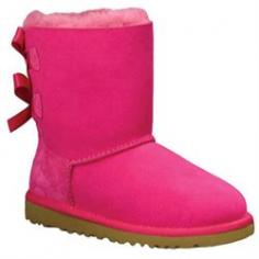 UGG AustraliaBailey Boot with Bow, Cerise, Toddler DetailsTwin-faced, brush-dyed sheepskin or single-face sheepskin UGG boot. Dyed shearling (Australia), 100% UGGpure wool, or mixed shearling and UGGpure wool lining. Satin bow detail adorns back of shaft. Suede heel guards. Molded EVA sole for traction. Wear barefoot to maximize benefits of plush genuine grade A sheepskin or single-face sheepskin in a wide variety of temperatures. Bailey is imported. Sizing Note: Toddler sizes end in "T"; Youth sizes end in "Y". Toddler sizes are smaller than youth sizes. Designer About UGG Australia: When an Australian surfer visited the U.S. in 1978 and brought his home country's sheepskin boots with him, the idea for UGG Australia was born. With comfort and luxury as its two watchwords, UGG Australia soon built a stellar reputation in both categories. Beyond the well-known sheepskin boots spotted on a who's who-list of Hollywood stars, UGG Australia also features styles such as knit boots, shearling slippers, and leather hiking boots for men and women. Plus, there's a children's collection with wee sheepskin boots and even Mary Jane-style walking shoes.