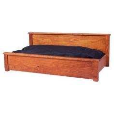 Rustic dog bed made from hand sawn pine. Hand rubbed finish. Offers a stable and durable sleeping area. Made in the USA. Dimensions: 16H x 38W x 30D inches. Dogs will love the comfortable design of the 2 Day Designs Standard Dog Bed. This bed features a smooth, raised pine wood design and a warm, hand-rubbed finish. Its sturdy build offers a cozy and enclosed area for your pet to rest and relax. About 2 Day Designs: Some 800,000 oak barrels are produced annually, many of them ending up in gardens as planters, some are simply destroyed. 2 Day Designs estimate that they have saved approximately 15,000 barrels from this ultimate end. From wine racks to occasional tables, they have developed over 50 items for this collection. Many of the products bear the branding and vineyard handling markings, as they were used in wine production. Color variation, distressing, and wood character are key elements in this handmade furniture line. 2 Day Designs prides themselves in enhancing wood's natural character with hand distressing, sanding, and seven different finish options. Circle saw marks are welcome! Some of their barrel products may even have visible numbers or writing on them from their previous lives in vineyards. Just like them, their products have a story to tell. Each product may vary slightly from the images shown. This is simply due to the nature of the resources. Reclaimed resources sometimes appear to have imperfections, these are unique product characteristics. It is part of each item's story. They have become repurposed.2 Day Designs is proud to continue their recycling heritage that began in 1993. It began with countless reclaimed white oak wine barrels, shipping crate pallets, and sawmill off-fall. They are proud of their record and commitment, and they ask for your help in protecting America's precious recourses whenever possible.