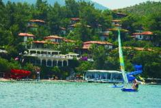 Located on a completely private peninsula and spread over 168,000 m2, the luxurious Club & Hotel Letoonia is a holiday resort of superlatives. It is stretched along 2km of Aegean coastline with 3 private beaches, surrounded by lush, verdant vegetation. There are 3,700 metres of walking trails. Fethiye can be reached within a short drive, while the international airport of Dalaman is about 57km away. The charming accommodation consists of rooms in the main building and bungalows, all with wooden-carved ceiling decorations typical of the region. They are beautifully appointed with all the necessary amenities. Guests wishing to be active can choose between a wide range of sports facilities including a fitness centre and water sports. A first-class spa & wellness area invites to relax and enjoy with all senses. A fantastic pool area, water slides, children's pools and entertainment and numerous excellent restaurants and bars make the offer complete. Simply the ideal place for couples and families with children.