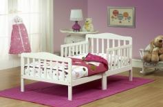 Constructed of all solid wood in a clean white finish. 2 side safety rails makes an easy transition from crib. 26.5-inch height makes in and out easy. Accommodates standard crib mattress (not included). 53L x 30W x 26.5H inches. When your baby isn't quite a baby anymore it's time for the Orbelle Contemporary Solid Wood Toddler Bed - White. Nothing compares to solid wood construction and quality so rest assured this bed will last. It even includes side safety rails so your little one won't fall out of bed in the night. In addition the perfect height of 26.5 inches ensures easy in and out and more peace of mind for you. All necessary tools are included for easy assembly. Accommodates a standard crib mattress not included. Make the transition smooth and beautiful with the Orbelle Toddler Bed. About Orbelle TradeBegun in Brooklyn NY in 1991 Orbelle has grown into a leading baby and teen furniture business still family owned and operated. Fast shipping and quality furniture with exclusive designs and colors keep Orbelle at the forefront of baby and kids lines of furniture. The transition from crib to toddler bed is made easier with this gorgeous bed that your child will love to snuggle up in. This Orbelle bed is made of solid wood and sized just right for a toddler. The side safety rails prevent accidental falls in the middle of the night, and the low height ensures that your little one can crawl in and out of bed with ease. It comes in a classic white that will match your child's room decor, and you can switch your child's crib mattress into the frame for a smoother transition.
