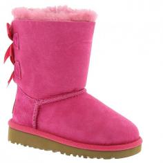 UGG AustraliaBailey Boot with Bow, Cerise, Toddler DetailsTwin-faced, brush-dyed sheepskin or single-face sheepskin UGG boot. Dyed shearling (Australia), 100% UGGpure wool, or mixed shearling and UGGpure wool lining. Satin bow detail adorns back of shaft. Suede heel guards. Molded EVA sole for traction. Wear barefoot to maximize benefits of plush genuine grade A sheepskin or single-face sheepskin in a wide variety of temperatures. Bailey is imported. Sizing Note: Toddler sizes end in "T"; Youth sizes end in "Y". Toddler sizes are smaller than youth sizes. Designer About UGG Australia: When an Australian surfer visited the U.S. in 1978 and brought his home country's sheepskin boots with him, the idea for UGG Australia was born. With comfort and luxury as its two watchwords, UGG Australia soon built a stellar reputation in both categories. Beyond the well-known sheepskin boots spotted on a who's who-list of Hollywood stars, UGG Australia also features styles such as knit boots, shearling slippers, and leather hiking boots for men and women. Plus, there's a children's collection with wee sheepskin boots and even Mary Jane-style walking shoes.