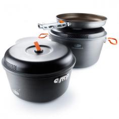 Throw on your chef hat and make a meal that rivals restaurant cooking with the large GSI Outdoors Pinnacle Base Camper cookset. Set includes 5-liter pot with lid, 3-liter pot with lid, 9 in. frypan, pot gripper, cutting board and a welded sink/stuff sack. All items nest neatly within the 5-liter pot and stow in the welded sink/stuff sack for easy packing. Pinnacle-series hard-anodized aluminum pots and frypan distribute heat evenly for efficient cooking; Teflon Radiance technology offers supreme scratch resistance. Teflon Radiance features a specially formulated topcoat to enhance heat dispersion for quick heating; nonstick coating is tough enough to handle use with most metal utensils. Lightweight, BPA-free plastic pot lids feature integrated strainers ideal for use with pasta and steamed vegetables; flip-up tabs on top make for easy lid removal. Sturdy cutting board has a flat side and a dished side to meet your food prep needs; when stowing the cookset put the cutting board between the pots to prevent clattering. Included folding pot gripper locks to and removes easily from exterior brackets on the 3-liter pot and frypan; gripper design prevents scratching of the nonstick surfaces. 5-liter pot features silicone-coated bail handles for a secure grasp while cooking up hearty meals. GSI Outdoors Pinnacle Camper cookset includes a welded sink basin that doubles as a carry bag.