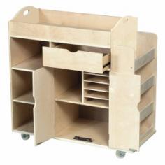 Made of birch, heavy duty casters and steel hardware. Features colored plexi windows. Pull-out drawer with ball-bearing casters. Center storage compartment with doors. Side dividers hold tall paper rolls or sheets. Recommended for children 3 and up. Dimensions: 34L x 16W x 30H in. About GuidecraftGuidecraft was founded in 1964 in a small woodshop, producing 10 items. Today, Guidecraft's line includes over 160 educational toys and furnishings. The company's size has changed, but their mission remains the same; stay true to the tradition of smart, beautifully crafted wood products, which allow children's minds and imaginations room to truly wonder and grow. Guidecraft plans to continue far into the future with what they do best, while always giving their loyal customers what they have come to expect: expert quality, excellent service, and an ever-growing collection of creativity-inspiring products for children.