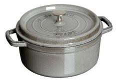 Dutch Ovens - The unique self-basting system of this enameled, cast-iron Staub round cocotte with lid is the culinary advantage to flavorful, professionally-cooked entrees. Handcrafted in France, Staub enameled cast-iron cookware is preferred by internationally-famous chefs for its superb heat distribution and retention. This slow-cooking Dutch oven hides its secret under the lid: spikes collect condensation and release, creating a rain forest effect to continuously shower juices over food. The circulation of heat with juices ensures poultry is baked to succulent perfection, beef and pork roasts cook evenly and vegetables are prepared to delicious al dente texture. This self-basting cycle allows ingredient flavors to maintain full intensity, while preserving nutritional values. Staub signature black matte enamel interior is a superior cooking environment for nonstick braising and caramelizing, and easy release. The more you cook with this enameled cast-iron 4-quart round Dutch oven, the better it pe - Specifications Models: 1102425 (black), 1102487 (grenadine), 1102491 (dark blue), 1102406 (cherry), 1102418 (graphite), 1102485 (basil) Materials: enameled cast iron 9 1/2" Dia. (12"L w/handles) x 4"H (6" w/lid & knob) Base: 7" Dia. Weight: 10-lb, 10-oz. Made in France Care and Use Dishwasher-safe Oven-safe to 500 F and broiler-safe Suitable for gas, electric, glass, halogen and induction stove tops