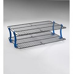 Non-stick coated metal rack with sturdy plastic legs. Stackable racks instantly double your counter space. Easy to clean and store. Snap-on legs are optional and easy to use. Cooling racks measure 16.5 L x 11.5 W inches. If you ever wished for more room in the kitchen you will love the Nordic Ware 43742 Kitchenware Stackable 11 x 16 inches Cooling Rack Set. It's simply brilliant! There never seems to be enough room for the cooling rack and now you can stack one on top to create the extra space you need. The cooling racks connect with sturdy snap-on legs and the nonstick surface means your cookies glide right into the cookie jar. The racks can be used separately or together and this little miracle of convenience is literally a snap to use. About Nordic Ware. Founded in 1946 Nordic Ware is a family-owned American manufacturer of kitchenware products. From its home office in Minneapolis Minn. Nordic Ware markets an extensive line of quality cookware bakeware microwave and barbecue products. An innovative manufacturer and marketer Nordic Ware is best known for its Bundt Pan. Today there are nearly 60 million Bundt pans in kitchens across America. The Nordic Ware name is associated with the quality dependability and value recognized by millions of homemakers. The company's extensive finishing technology and history of quality innovation and consistency in this highly technical and specialized area makes it a true leader in the industrial coatings industry. Since founding Nordic Ware in 1946 the company has prided itself on providing long-lasting quality products that will be handed down through generations. Its business is firmly rooted in the trust dedication and talent of its employees a commitment to using quality materials and construction a desire to provide excellence in service to customers and never-ending research of consumer needs.