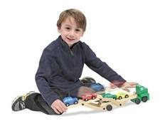 This fantastic truck is ready to spark the economy by picking up and delivering four colorful cars. Its "easy-load and lower" ramps provide two levels for the new vehicles. Your little trucker will love "hitting the road" with this wooden six-wheeler! For ages 3 and up.