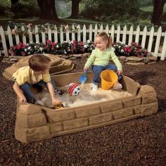 Get Playing Imaginatively with This Amazing Sun-Themed Step 2 Kids Sandbox You can enjoy the summer months with this incredible step 2 naturally playful sandbox featuring a fun sun theme in a contemporary design that's perfect for any backyard. It blends easily with your landscaping theme, while providing hours of provide amusement to children. The sandbox provides enough room for multiple children to build sand castles at once and enjoy the outdoors. The step 2 kids sandbox is built with an expansive lid to protect the contents of the sandbox. The sunshine-themed lid also protects the sandbox from weather elements and pets. The sandbox has been built with four cornerstone seats so that kids can enjoy playing with their friends. The sandbox is already assembled, so it will only require figuring out the perfect place to put it in your backyard. Creative types can also turn the sandbox into a large planter that holds flowers and other attractive plants. A backyard can turn into a floral wonderland with this elegant sandbox that can easily be turned into a gardening tool. The sandbox also makes for the perfect first garden for young ones to care for in a backyard.