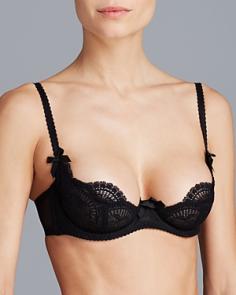 L'Agent by Agent Provocateur Vanesa Non Pad Demi Bra (L013-14). This sexy demi underwire bra features soft embroidered lace cups and sheer mesh sides. Made of polyamide/polyester/elastane. 2-part, lined underwire cups have vertical seaming. Mesh lining along bottom of cups. Sewn-on elastic at top of cup. Sewn-on elastic underband for added support. Center panel - lined, arched for high tummy comfort, with grosgrain bow. Seamed sides and back feature sewn-on elastic for fit. Boning at seamed sides add extra support. Fully adjustable, wide-set elastic straps adjust in the back with coated metal hardware. Back coated metal hook-and-eye closure, see Fitter's Comments below for hook count. See matching L'Agent by Agent Provocateur Vanesa Bikini Panty L013-30. Please Note: Model is wearing nipple covers for modesty.