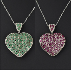 Beautiful vintage natural ruby and emerald studded puffy heart pendant necklace handcrafted in sterling silver. All the open back rubies and emeralds form a floral pattern with a delicate braid surround and decorative jeweled bail. The perfect Valentine's Day gift, bridal necklace, or for that special someone on their anniversary. 