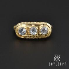 Beautiful and exquisite Art Deco engagement ring featuring three sparkling blue aquamarine gemstones all set in a 14K gold filigree mounting. Elevated off the finger with a fine filigree mounting, the three gemstones are all open back and join detailed shoulders. The ring is perfect for an alternative engagement ring, great for stacking or for that classic look!
