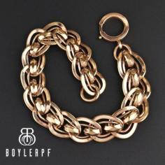 Beautiful interlocking Antique Edwardian watch chain bracelet in a rose rolled gold. The wide bracelet has ornate ribbed links entwined to form the chain with the piece ending with a swivel dog clip clasp. Great worn as a bracelet or stacked with others and also works for the gentlemen or the ladies!