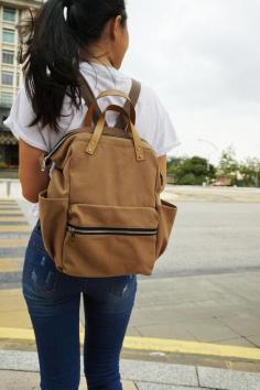 A NEW VERSION ZIPPER BACKPACK This unique back pack is made with Camel Brown canvas / faux leather strap. which is Comfortable to touch, strong, durable and very fine material . 