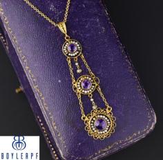 Elegant 14K gold filigree Edwardian/Art Nouveau pendant necklace with natural amethyst and delicate seed pearls hailing from the turn of the last century, circa 1900s.  
