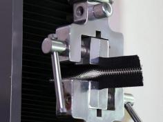 Secondly, an effective zipper testing method should also develop a test plan, select suitable testing equipment and environment according to the actual situation, and strive to improve testing efficiency and accuracy. For example, for mass-produced zipper fittings, testing can be conducted by sample sampling, and standard testing time can be reasonably shortened according to the nature of work, testing items and other factors, so as to better ensure product quality and production efficiency.zipper-testing.jpgIn short, through a comprehensive zipper testing method can not only strongly ensure product quality, but also make an important contribution to improving production quality and reducing costs. We should continue to strengthen the research and improvement of zipper testing machine to provide more reliable and high quality zipper products for consumers.