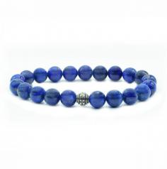 This Natural Stones bracelet features beautiful celestial deep blue semi-precious stones. The bracelet has a style length of 19 cm, suitable for a wrist size of 18. The rounded beads come in two sizes: 8 mm and 10 mm. The bead count varies, with one variant having 21 beads and another variant having 19 beads along with a Buddha charm. The bracelet is designed with an elasticated rope for easy wearing.

The deep blue stones in this bracelet are connected with qualities of strength and courage. They also symbolize royalty and perception, reflecting a sense of regality and keen insight. Additionally, these stones are associated with intellect and truth, fostering mental clarity and a pursuit of knowledge.

Wearing this bracelet not only adds a touch of elegance to your attire but also serves as a reminder of your inner strength, courage, and intellectual pursuits. Please note that while gemstones have been attributed with certain qualities, their effectiveness is subjective, and they should not replace professional advice or treatment.