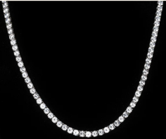 Introducing the Cornelia Necklace, a stunning and bold statement piece that commands attention with its radiant beauty. This remarkable Riviere necklace boasts an impressive assembly of 75 round, 5mm simulated diamonds, each meticulously secured within a secure 4-prong setting, showcasing the precision-cut brilliance of cubic zirconia. Each of these remarkable stones shines with a weight of 0.25 carats, making it a true testament to luxury and elegance.