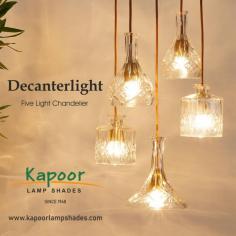 The Decanterlight Five Light Chandelier is a stunning lighting fixture that combines functionality with aesthetic appeal. It typically features five decanter-shaped glass shades arranged in an elegant chandelier design. Each shade resembles a decanter, giving the fixture a luxurious and sophisticated look.
