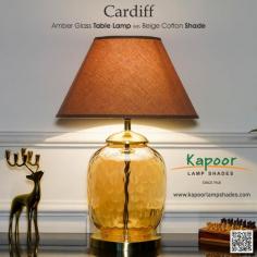 Brighten your space with the Cardiff Amber Glass Table Lamp! Transform your home with this elegant lamp, featuring a stunning amber glass base paired with a classic beige cotton shade. Perfect for adding a touch of warmth and sophistication to any room. A versatile piece that complements both modern and traditional decor.