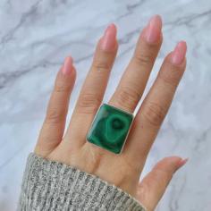 Malachite gemstone rings that is famous among Meditation and Mindfulness

Welcome the dynamic and lively beauty of the Sagacia Statement Malachite Rings. These captivating jewelry pieces feature 100% genuine and real malachite gemstones set in pure 925 sterling silver. The malachite stone within the ring showcases striking bands and swirls of green and black. As a gemstone that is famous among Meditation and Mindfulness Practitioners for its protective abilities and transformative properties, malachite is known as the stone of positivity and healing. 
