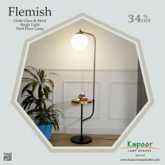 This stunning floor lamp features a sleek metal frame with a beautiful globe glass shade, providing a soft, ambient glow that enhances any room's atmosphere. The integrated shelf offers a practical solution for small spaces, giving you a convenient spot to place your favorite books, plants, or decorative items.