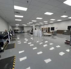 Epoxy flooring refers to a visually appealing floor featuring multiple epoxy resin layers. The technique creates a seamless & glossy floor, enhancing aesthetics & durability. Epoxy flooring tech is typical in various flooring settings for its resistance to wear, chemicals, and stains. It balances elegance and practicality in residential garages, commercial showrooms, and industrial facilities.