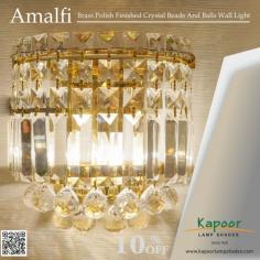 Add a touch of luxury to your walls with the Amalfi Brass Polish Finished Crystal Beads and Balls Wall Light! This stunning fixture combines the brilliance of crystal with the warmth of brass, creating an elegant glow that transforms any space. Perfect for adding that extra sparkle to your home.