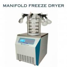 Labtron Manifold Freeze Dryer is a floor-standing unit with a 3 kg condenser capacity, -50°C condenser temperature, and a 0.12 m² drying area. It features 4 shelves, an LCD touch screen, an anti-corrosion cold trap, and a built-in oil mist filtration system with a vacuum pump oil return device.
