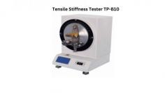 Labtron Tensile Stiffness Tester measures the bending resistance of paper and paperboard using the international static bending method. It clamps the specimen vertically, bending it to a set angle to gauge stiffness in mN.m. Key features include a 1-500 mN.m range (divided into 7 segments) and 200° ± 20°/min test speed.