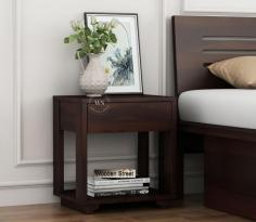 Designed with both style and utility in mind, the Kristin Bedside Table features a smooth walnut finish that complements contemporary decor. With a sturdy drawer and open shelf, this bedside table is perfect for creating a neat and organized sleeping space.

Visit For More Info - https://www.woodenstreet.com/bedside-tables