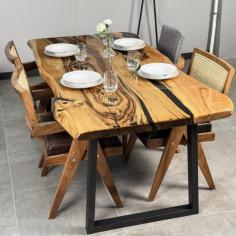 Each table is one-of-a-kind due to its distinctive grain patterns and luxurious finishes, and its robust construction guarantees that it can endure regular usage, making it ideal for special occasions, family meals, and get-togethers. 